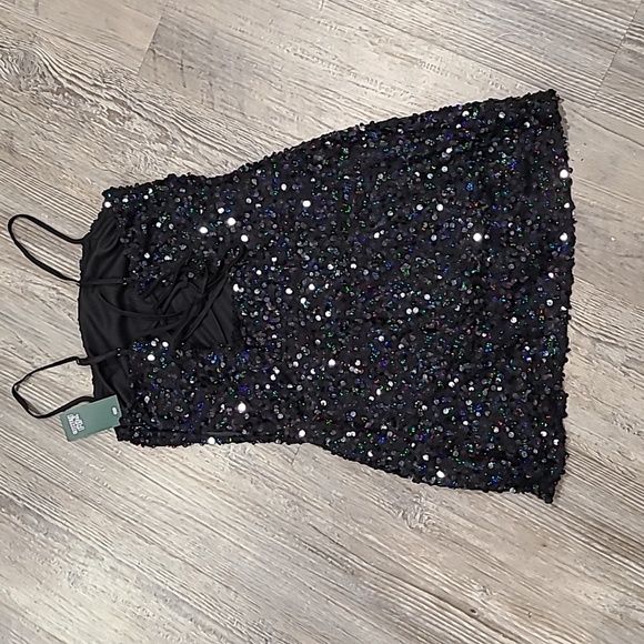 Black sleeveless mini dress with sequins and a form-fitting design - Picture 5 of 8